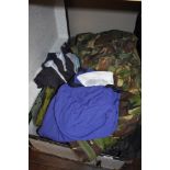 A selection camouflage clothing and similar in metal trunk.