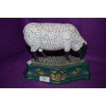 A cast iron sheep door stop.