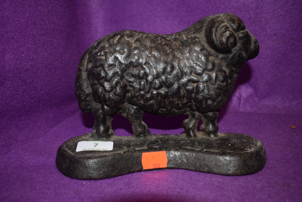 A cast iron sheep door stop.