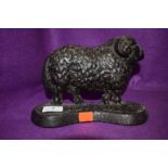 A cast iron sheep door stop.