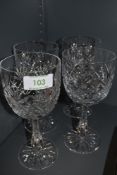 A set of four Thomas Webb crystal wine glasses.