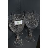 A set of four Thomas Webb crystal wine glasses.