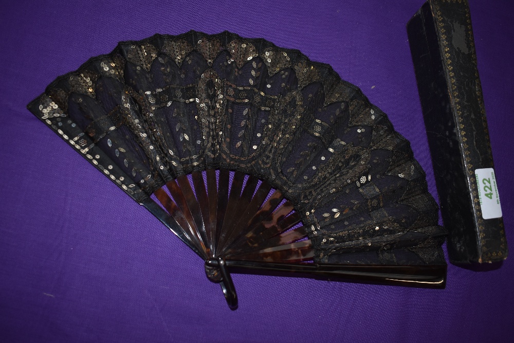 A late 19th century silver spangled black gauze fan with tortoiseshell ribs , in silk lined box.