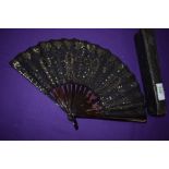 A late 19th century silver spangled black gauze fan with tortoiseshell ribs , in silk lined box.