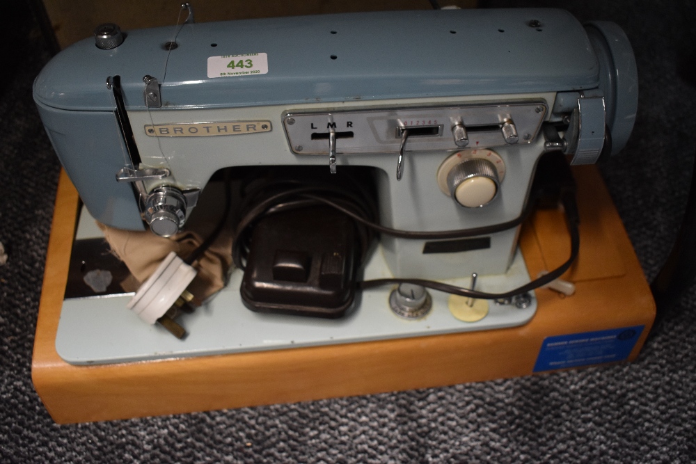 A vintage brother sewing machine and case serial number M768432.