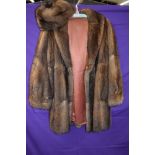 A vintage mink jacket with matching hat,around 1960s in a shorter length,medium size approx.