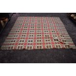 A large vintage Welsh wool blanket with fringed edging in brown, pink and duck egg tones.