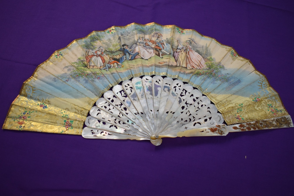 A hand painted lithograph fan, circa 1850, showing classical scene with ornate inlaid mother of - Image 2 of 2