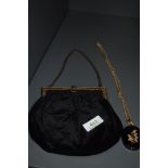 A late 19th/early 20th century black velvet bag having gold tone frame and clasp,alongside a jet