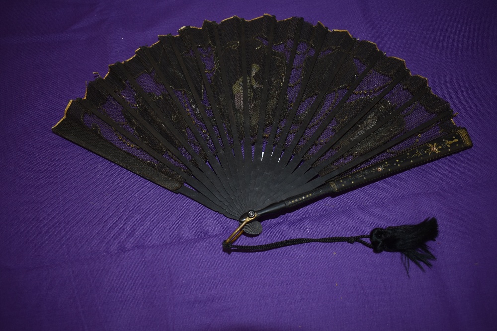 A Victorian black gauze and net fan having painted inserts depicting ladies and countryside scenes. - Image 2 of 2