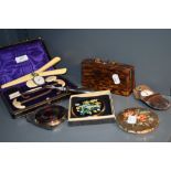 A selection of vintage compacts and a manicure set in early plastic tortoiseshell effect case.
