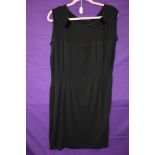 A vintage 1930s black dress with darted bodice and velvet accents,no fastening, medium size approx.