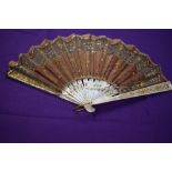 A late 19th early 20th century silk fan having sequins and spangles with mother of pearl ribs with