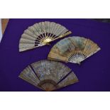 A lot of three 19th century fans, painted silk leaf fan with gilded wooden ribs,another in silk with