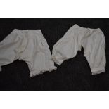 Two pairs of Victorian bloomers, crisp cotton with both having intricate details to the legs, both