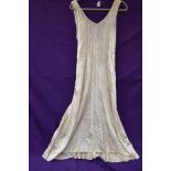 A 1920s full length champagne velvet dress,minor underarm disolouration.small to medium size.