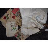 A collection of vintage and antique table linen with embroidered pieces, crotchet work and some