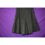 A pair of bottle green 1940s culottes/shorts, pleats to sides and button fastening to each.
