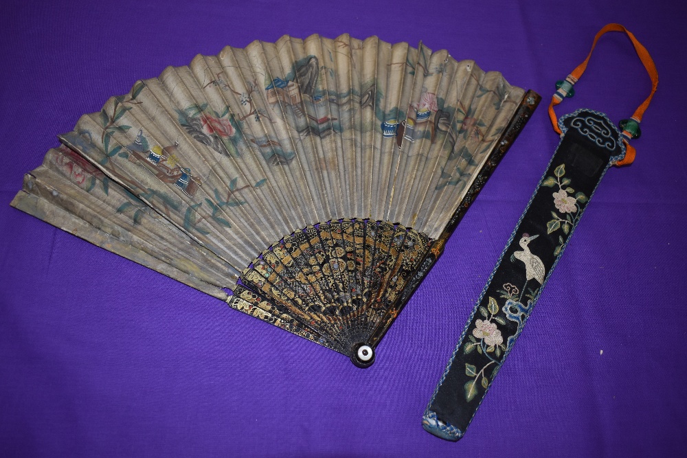 A hand painted paper fan, around early 18th century,depicting Chinese scene with mother of pearl