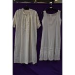 A victorian nightdress having 3/4 sleeves,trimmed to bodice with broderie anglais and a petticoat