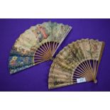 Two paper fans,both having wooden ribs and painted classical scenes, a little wear in places.