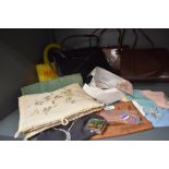 A mixed lot of vintage items including clasp fastening handbags, collars, handkerchiefs and case and