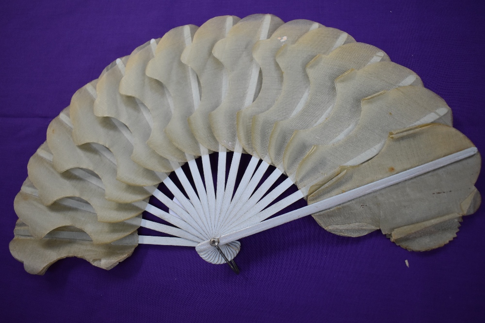 A Victorian fan having hand painted floral paper and gauze like leaves with gilt detailing and - Image 2 of 2