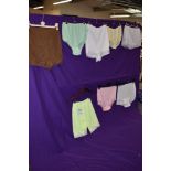 A selection of 1950s and 60s colourful nylon knickers, some having tags still attached,includes