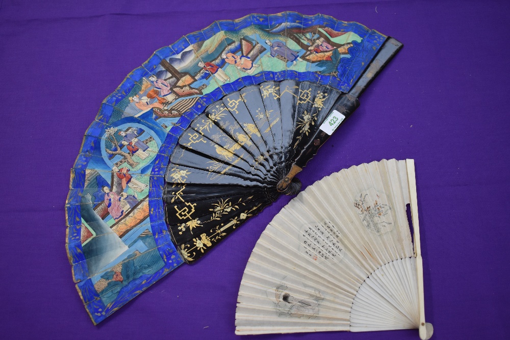 Two fans, one Chinese,around 18th century with paper leaf and ivory ribs depicting lady, the other a