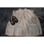 Two pairs of baby shoes and a smock dress, around 40s/50s.