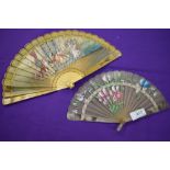 Two fans, one around 19th century depicting a classical scene,the other early 20th century having