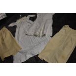 A small lot of early 20th century items,Two childrens wool petticoats or undergarments,a dress