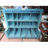 A Globe and Simpson parts rack or shelf unit in blue wood.