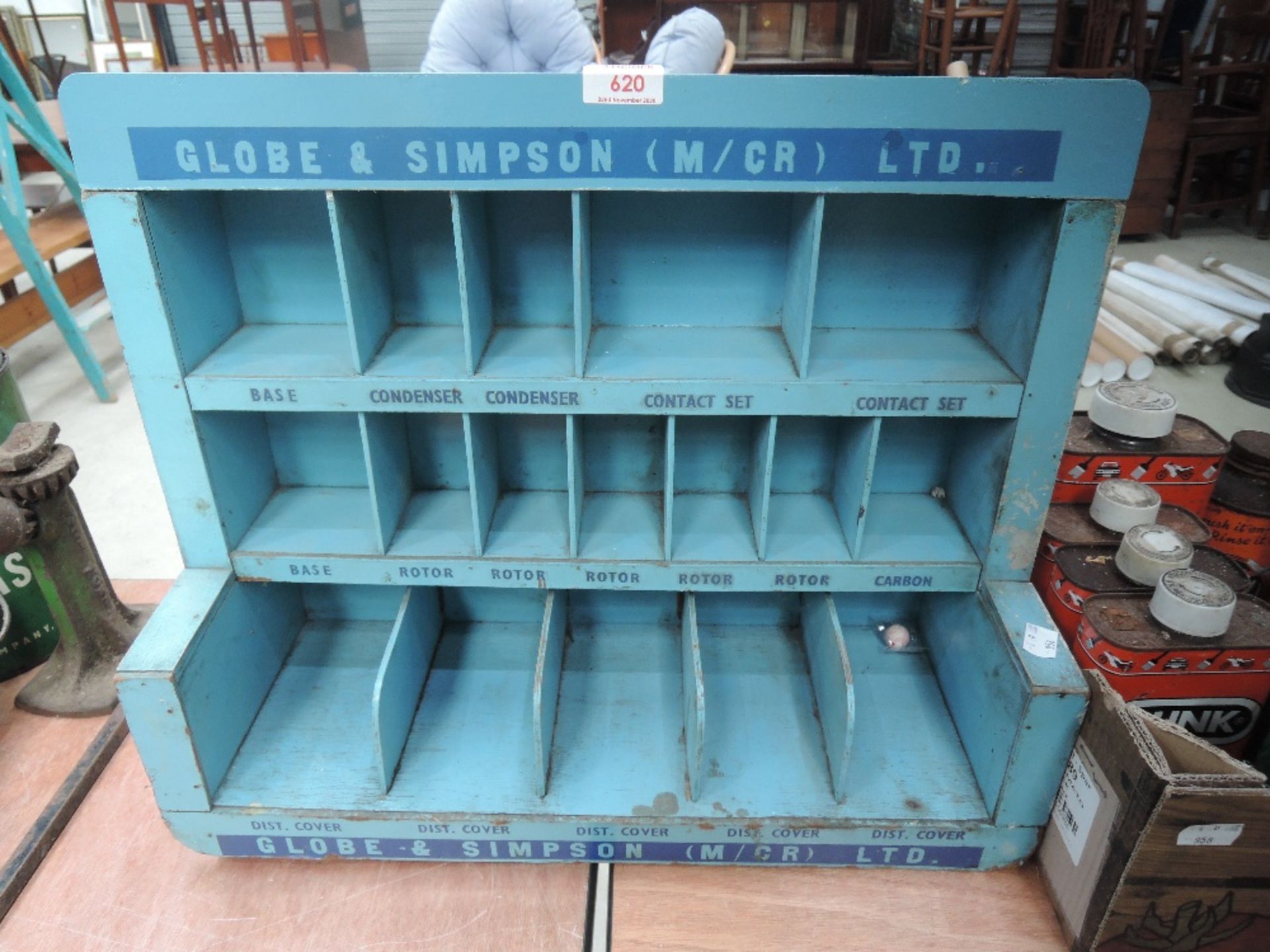 A Globe and Simpson parts rack or shelf unit in blue wood.