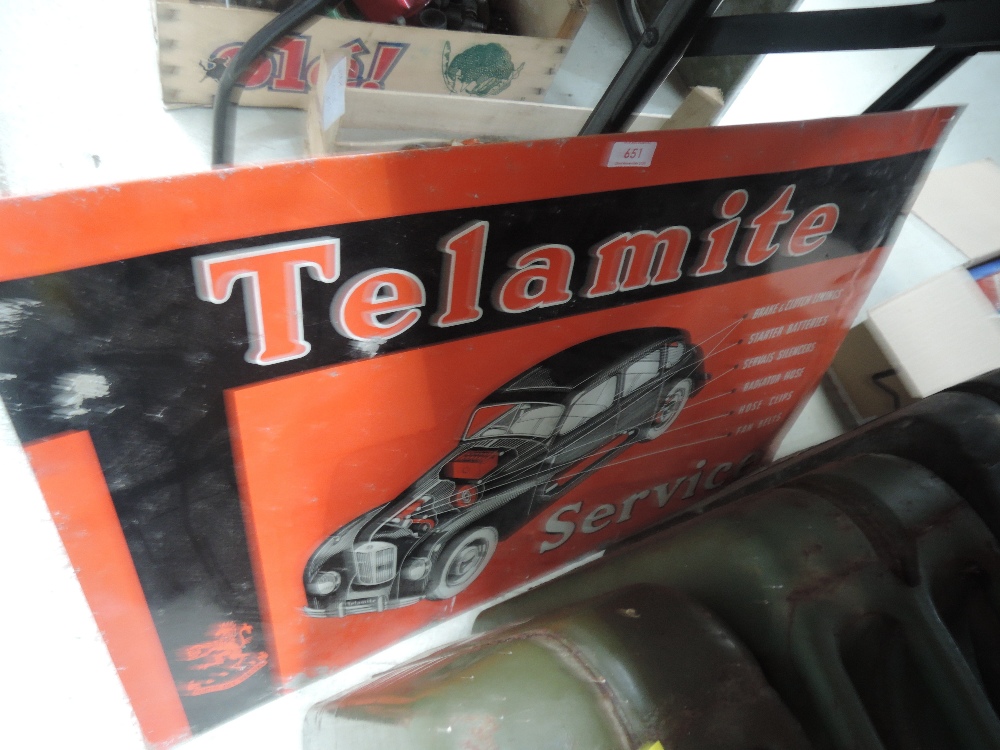 A vintage tin Telamite sign.