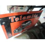 A vintage tin Telamite sign.