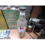 A glass Mobiloil oil bottle with original cap.