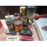 A selection of garage advertising tins car polish and Duckhams Nol oil