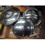 Three car hub caps, for Jaguar, Austin and Wolsey and an assortment or vintage key rings.