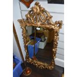 An ornate Chippendale style mirror