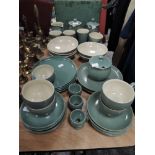 A selection of green Denby tableware, around 40 items in total.