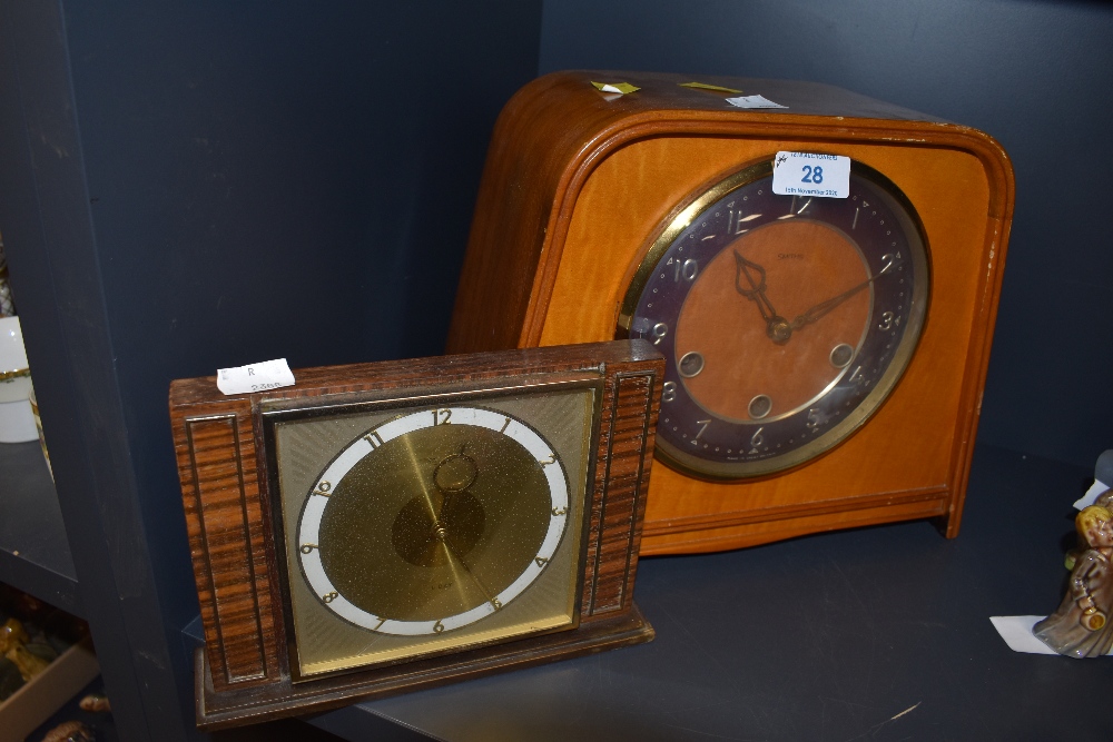Two vintage wooden mantel clocks the large one being Smiths and having chiming mechanism.