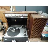 A vintage portable Ferguson record player with fold down deck and speaker.