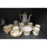 A Noritake part coffee set comprising of six cups and saucers,sugar basin, creamer and coffee pot,