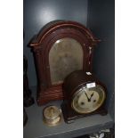 An early plastic Enfield chiming mantel clock and similar wooden cased mantel clock with bevelled