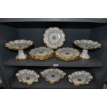 A part dinner service by Crescent china having scalloped design with hand painted and gilt