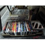 A large mixed lot of DVDs,CDs and two vintage books.