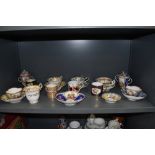 A fine selection of antique and later tea and coffee cups including Crown Derby Rockingham style and