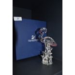 A glass figurine of a flamingo by Swarovski in box