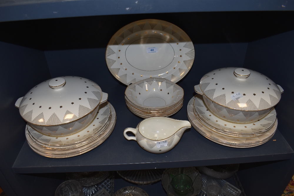 A part dinner service by Alfred Meakin with cream and gold design